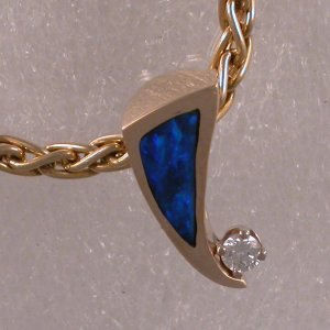 Enlarged view of James Hardwick's modified JM132 in 14KT with opal and diamond.