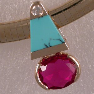 Modified JM63 slide in 14KT with diamond, ruby and turquoise