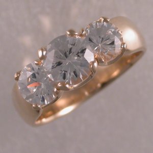Custom made 14KT yellow ring with 3 diamonds.